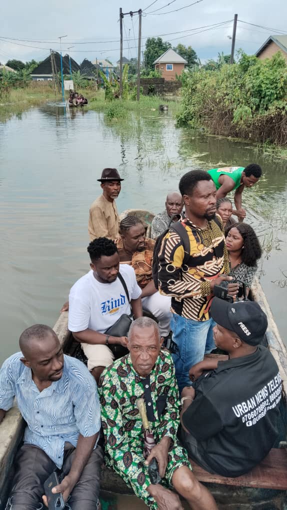 Residents navigating floodwater